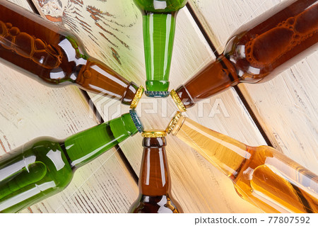 Star from glass bottles of beer. 77807592