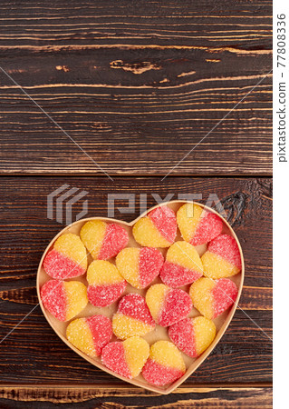 Valentines Day background with colorful candies. 77808336
