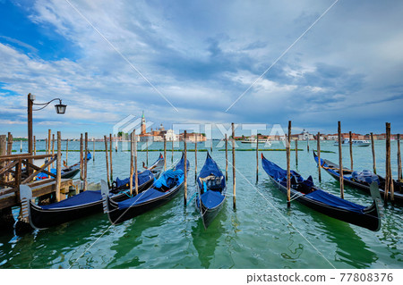 Gondolas and in lagoon of Venice by San Marco square. Venice, Italy Gondolas and in lagoon of Venice by San Marco square. Venice, Italy 77808376