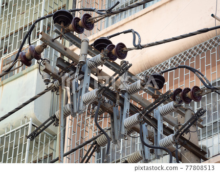 Electric pole with electric transformers and electrical cables  77808513