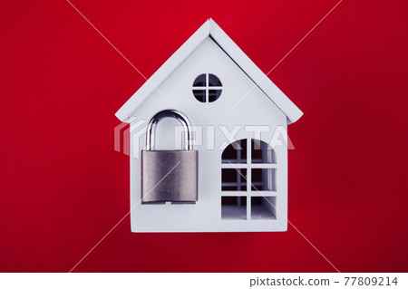 White house with lock shut off on red background. Alarm and security concept White house with lock shut off on red background. Alarm and security concept 77809214