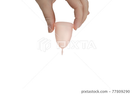 Womans hand holding menstrual cup, period cup isolated on white background with copy space, alternative product zero waste eco friendly Womans hand holding menstrual cup, period cup isolated on white background with copy space, alternative product zero waste eco friendly 77809290
