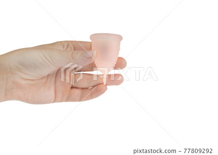 Womans hand holding menstrual cup, period cup isolated on white background with copy space, alternative product zero waste eco friendly Womans hand holding menstrual cup, period cup isolated on white background with copy space, alternative product zero waste eco friendly 77809292