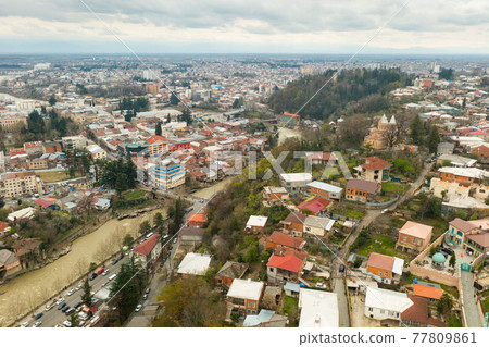 Aerial view of Kutaisi cityscape on Rioni River in springtime 77809861