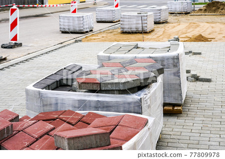paving with paving stones of different colors, view of the construction site paving with paving stones of different colors, view of the construction site 77809978