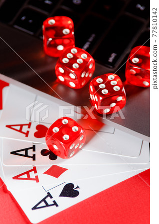 Online poker concept. Playing chips and dices close-up Online poker concept. Playing chips and dices close-up 77810142