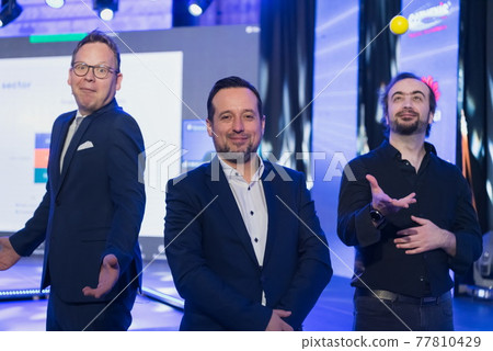 Businessman portrait on conference meeting, presenter joining a seminar via video conference call in empty convention center. Online webinar or seminar via social network broadcast in new normal 77810429