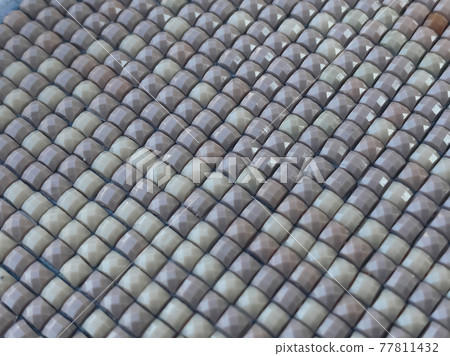 Close-up, colorful texture square diamond embroidery bright. Hobbies and entertainment. Close-up, colorful texture square diamond embroidery bright. Hobbies and entertainment. 77811432