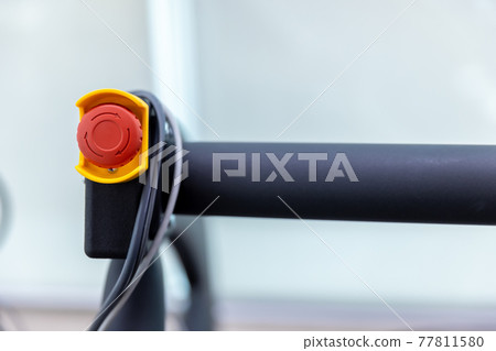 The red emergency button or stop button for Hand press. 77811580
