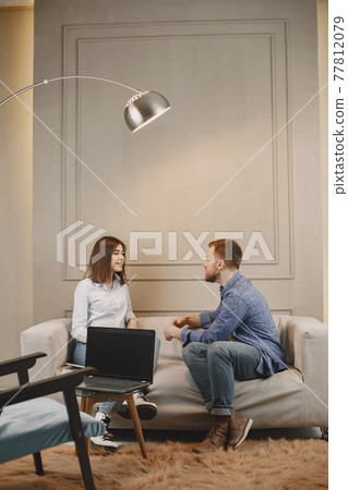 Young woman talking with her male pschycologist Young woman talking with her male pschycologist 77812079