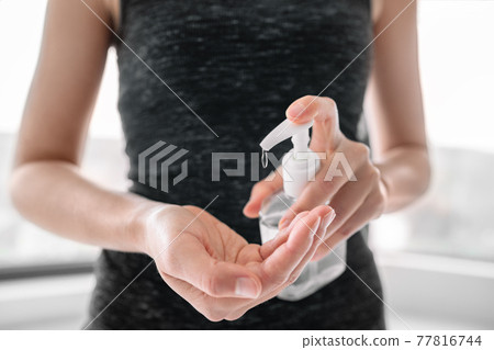 Hand sanitizer bottle disinfecting hands hygiene. Coronavirus rubbing with alcohol gel for COVID 19 outbreak spreading prevention 77816744