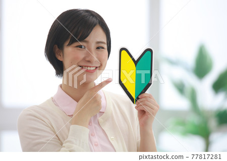 Image of a caregiver with a beginner mark 77817281