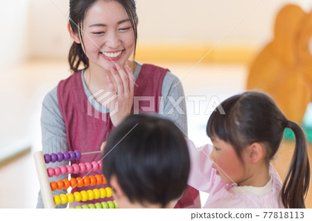 Children playing with educational toys 77818113