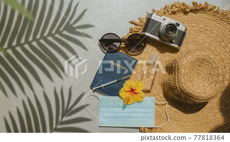 Travel coronavirus vaccine passport fully vaccinated tourists summer vacation. Essentials what to bring on flight . Face mask, hand sanitizer bottle, hat, sunglasses, camera on palm tree background Travel coronavirus vaccine passport fully vaccinated tourists summer vacation. Essentials what to bring on flight . Face mask, hand sanitizer bottle, hat, sunglasses, camera on palm tree background 77818364
