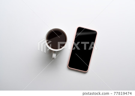 Top view of mock up mobile phone and coffee cup on white background. 77819474