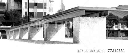 Frog perspective of a bench in a park in black and white. 77819831