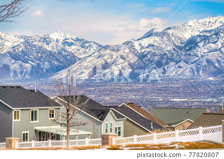Residential landscape with Wasatch Mountains and valley scenery in background 77820807