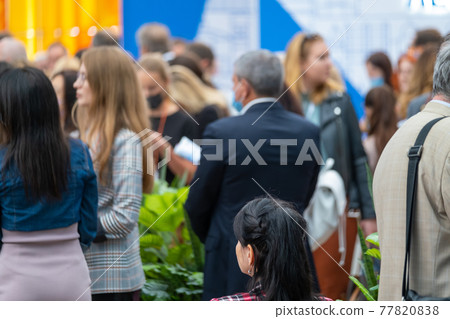 Unrecognizable people gathering in all during conference Unrecognizable people gathering in all during conference 77820838