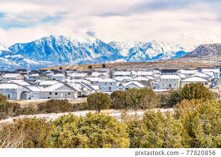 Valley landscape with fantastic mountainscape of the snowy Wasatch mountains Valley landscape with fantastic mountainscape of the snowy Wasatch mountains 77820856