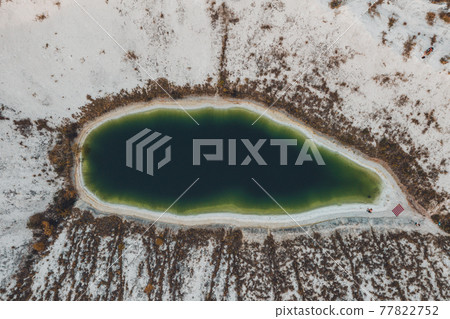 A lake formed on phosphogypsum waste, a tourist find in Ukraine, white mountains from phosphate waste. 77822752