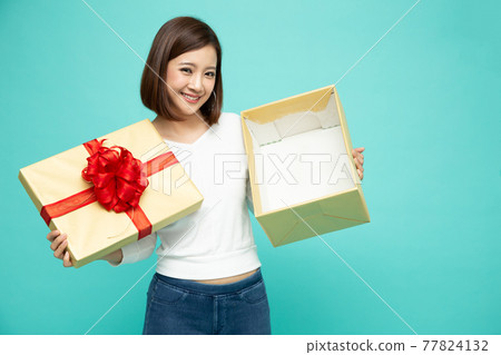 Happy beautiful asian woman smile and holding gift box isolated on white background. Teenage girls in love, Receiving gifts from lovers. New Year, Christmas and Valentines Day concept Happy beautiful asian woman smile and holding gift box isolated on white background. Teenage girls in love, Receiving gifts from lovers. New Year, Christmas and Valentines Day concept 77824132