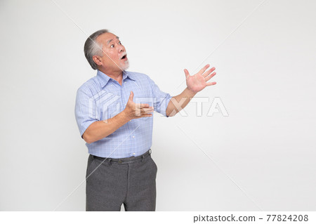 Portrait of excited screaming senior asian man standing isolated over white background, Wow and surprised concept Portrait of excited screaming senior asian man standing isolated over white background, Wow and surprised concept 77824208