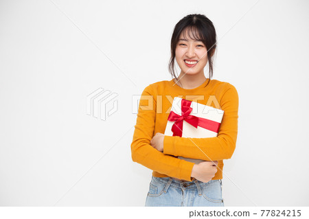 Happy beautiful asian woman smile and holding gift box isolated on white background. Teenage girls in love, Receiving gifts from lovers. New Year, Christmas and Valentines Day concept Happy beautiful asian woman smile and holding gift box isolated on white background. Teenage girls in love, Receiving gifts from lovers. New Year, Christmas and Valentines Day concept 77824215
