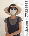 Asian female tourists wear gray clothes, hats, glasses and face masks. 77824663