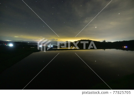 Starry sky reflected in rice fields that have been planted in Hakushu-cho, Hokuto City Starry sky reflected in rice fields that have been planted in Hakushu-cho, Hokuto City 77825705