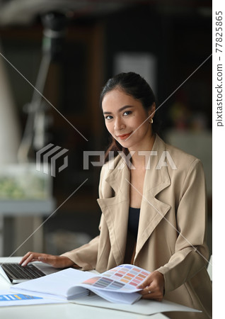 Portrait shot young designer formal in modern office. Portrait shot young designer formal in modern office. 77825865