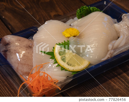 Squid sashimi with head and geso. 77826456