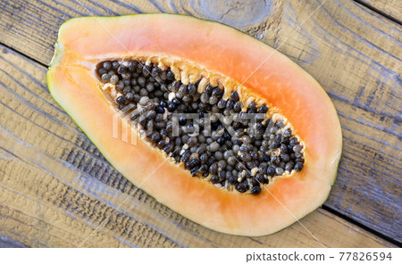 Papaya on the wooden board Papaya on the wooden board 77826594