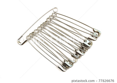 metal safety pins isolated on white background metal safety pins isolated on white background 77826676