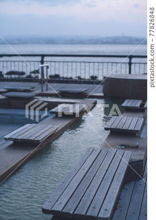Footbath at Sakurajima Lava Nagisa Park at dusk Footbath at Sakurajima Lava Nagisa Park at dusk 77826848