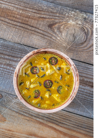 Bowl of yellow curry 77827415