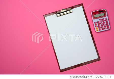 plastic pink calculator and folder with blank white sheets on pink background plastic pink calculator and folder with blank white sheets on pink background 77829005