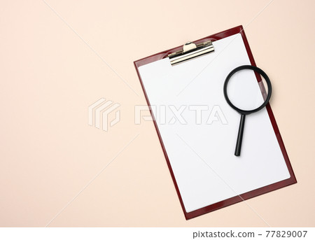 folder with blank white sheets and a black magnifier on a beige background. Background for inscriptions folder with blank white sheets and a black magnifier on a beige background. Background for inscriptions 77829007