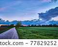 Country road at sunset 77829252