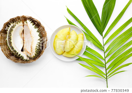 Fresh ripe cut durian on white background. Fresh ripe cut durian on white background. 77830349