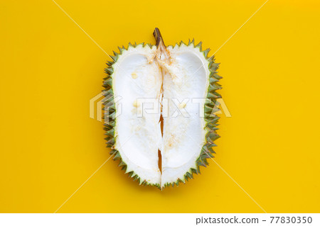 Durian peel on yellow background. 77830350