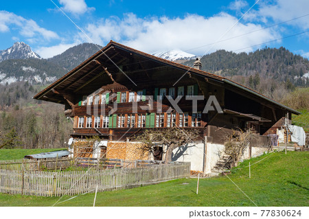 Typical historic farmhouse in Simmental, Switzerland 77830624