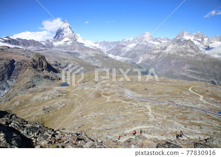 View from the hiking trail from the Gornergrat to Lake Riffelsee (Switzerland) View from the hiking trail from the Gornergrat to Lake Riffelsee (Switzerland) 77830916