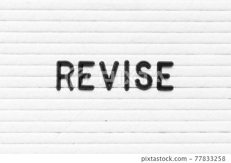 Black color letter in word revise on white felt board background Black color letter in word revise on white felt board background 77833258