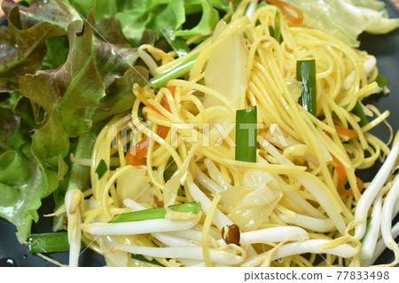 fried yellow vermicelli with cabbage and bean sprout vegetarian food on plate fried yellow vermicelli with cabbage and bean sprout vegetarian food on plate 77833498