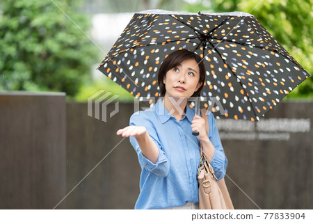 Young woman rain umbrella rainy season 77833904