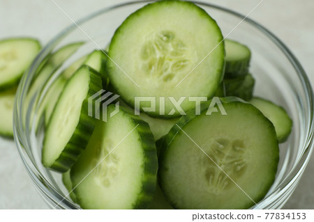 Bowl with ripe cucumber slices, close up Bowl with ripe cucumber slices, close up 77834153
