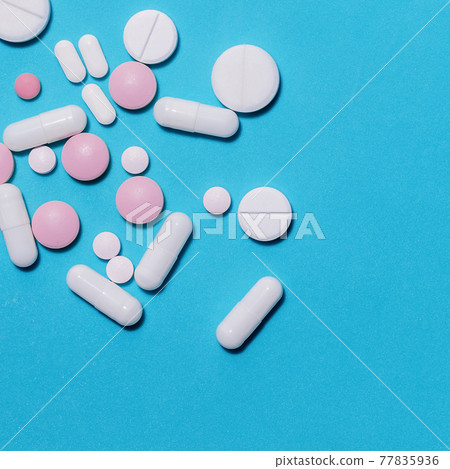 tablets, vitamins and dietary supplements on a blue background . tablets, vitamins and dietary supplements on a blue background . 77835936