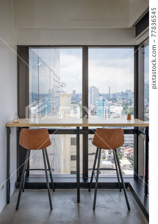 Wooden desk with chairs at corner modern office 77836545