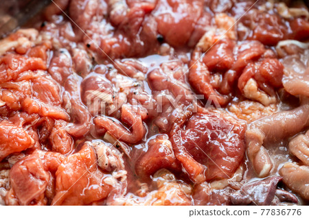 Various parts of raw sliced pork with marinated pork, pork belly, pork liver in stall 77836776