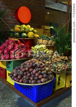 Exotic and tropical fruits on the market of Asia, Thailand, Vietnam. Mini bananas, longan, pitaya Dragon Fruit, papaya. Exotic and tropical fruits on the market of Asia, Thailand, Vietnam. Mini bananas, longan, pitaya Dragon Fruit, papaya. 77838908